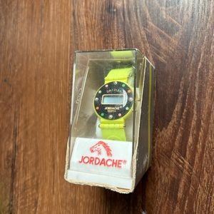 Vintage 1980’s still in packaging Jordache watch neon green. Fully working.